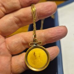 Unique Item. Antique pendant with a faded picture of a lady.