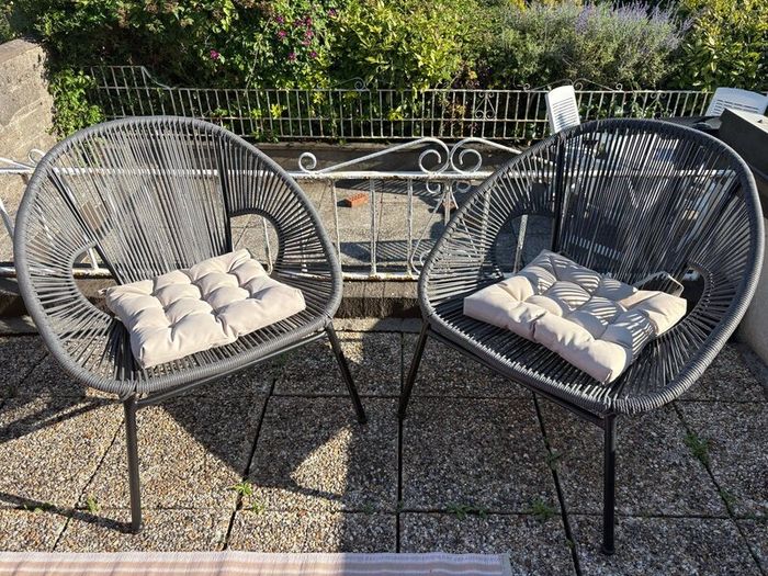 Pair of woven garden chairs