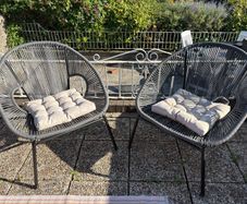 Pair of woven garden chairs