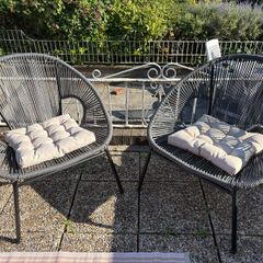 Pair of woven garden chairs