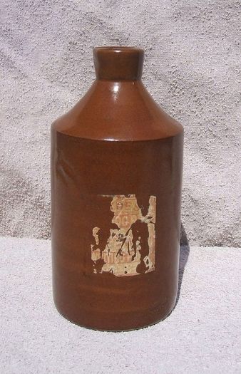 Stoneware antique ink bottle (large size 7.5" high) - made by Joseph Bourne of Denby (1880's - 1910's). Superb condition with remnants of label.