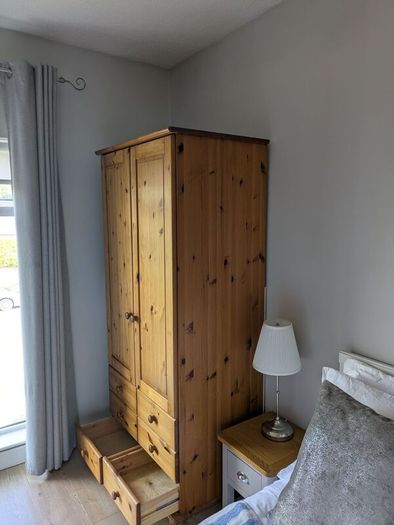 solid pine wardrobe with drawers.