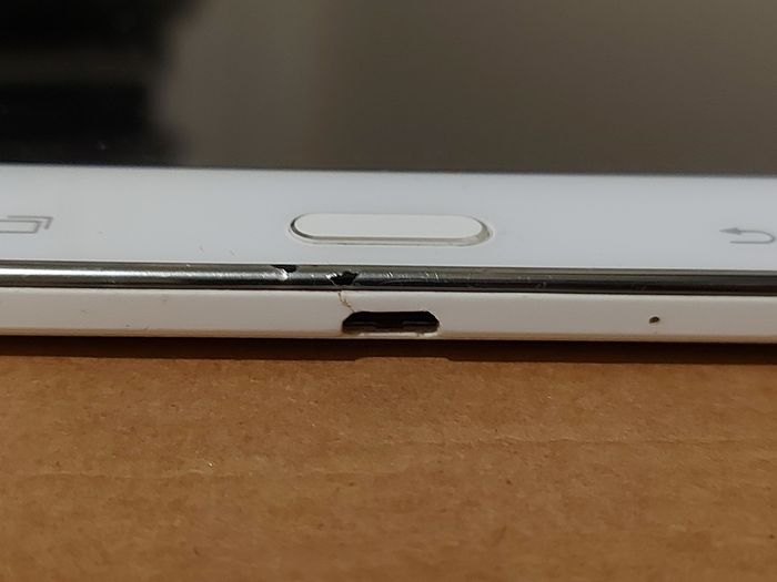 Samsung Galaxy Tab 4, Model SM-T530, 16GB, White, working great, in excellent condition and with a bunch of Family-children  movies