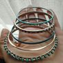 Charming bracelets in silver and blue tones. Image 4