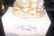 This collectible David Winter Cottage from 1985 features the HOGS HEAD BEER HOUSE, with Box