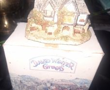 This collectible David Winter Cottage from 1985 features the HOGS HEAD BEER HOUSE, with Box