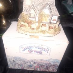 This collectible David Winter Cottage from 1985 features the HOGS HEAD BEER HOUSE, with Box