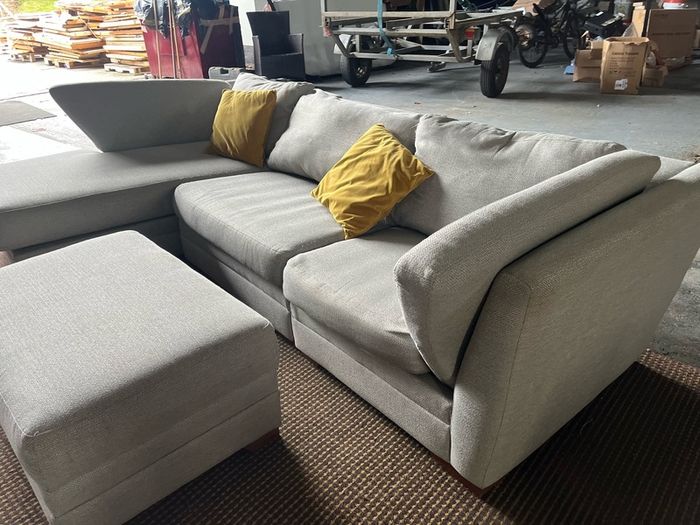 Grey corner sofa with matching footstool