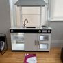 kids play kitchen by Plum with wooden food accessories Image 2