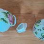 Tea for one: tea pot and cup with rose design on white Image 3