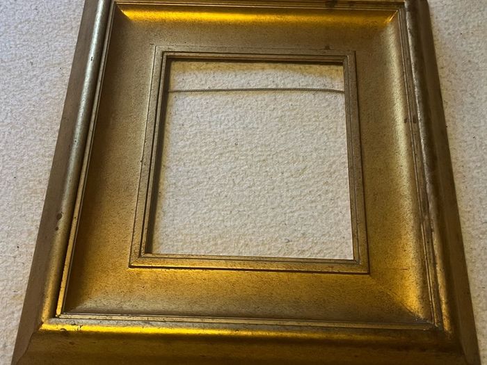 frame This is a modern, deep-profile gilt wood picture frame with a slip / inner liner profile.