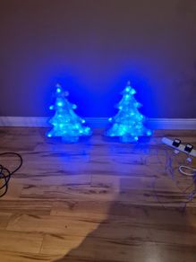 2 blue plug in Christmas trees.