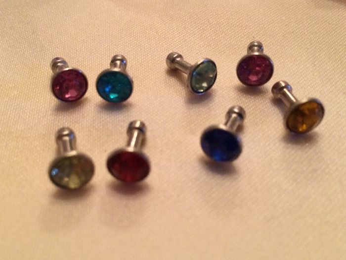 Brand new 8 pack of diamond plug in dust covers for phone and tablets