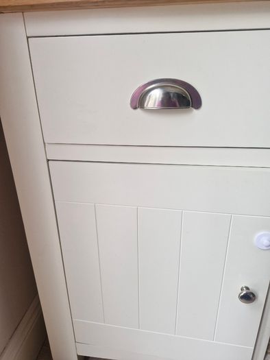 Cream and oak sideboard