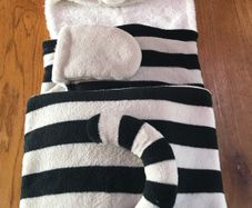 Child's cosy novelty raccoon hooded wrap fleece blanket.