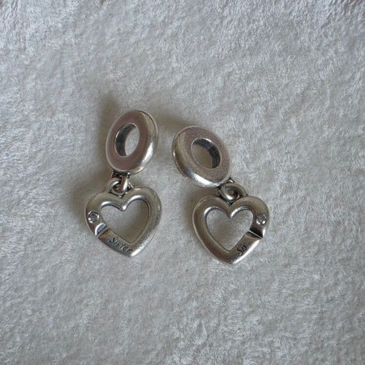 Pandora linked sister hearts split dangle charm. Very good condition hallmarked