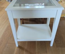 Glass-topped side table