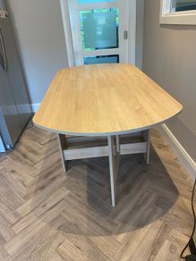 Oak dining table with drop leaf sides