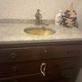 Bathroom sink, tap, drawers and mirror. Image 2