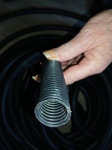 Black corrugated closed conduit.