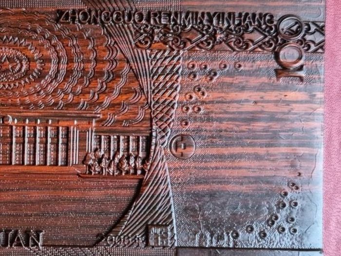 Carved wooden banknote. 100 yuan.