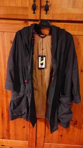 Ladies unusual gray coat fully lined. New with tags. Beautiful detail on the back.