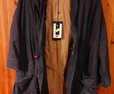 Ladies unusual gray coat fully lined. New with tags. Beautiful detail on the back.