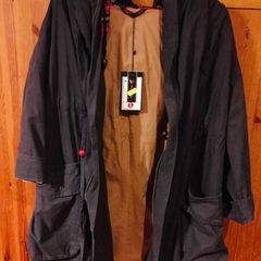 Ladies unusual gray coat fully lined. New with tags. Beautiful detail on the back.