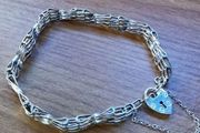 ASJ Sterling Bracelet With Dangling Heart