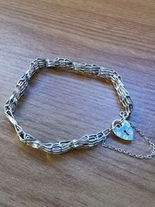 ASJ Sterling Bracelet With Dangling Heart