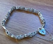 ASJ Sterling Bracelet With Dangling Heart