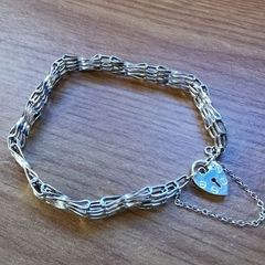 ASJ Sterling Bracelet With Dangling Heart