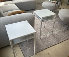 Two white side tables