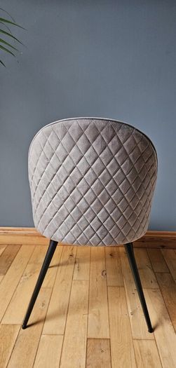 Grey velvet chair with black legs