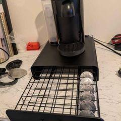 Nespresso Vertuo Black with coffee pods & shelf