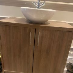 Bathroom press and bowl and taps