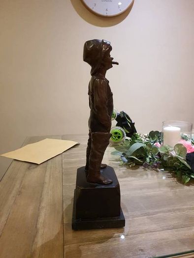 Fisher boy, bronze statue
