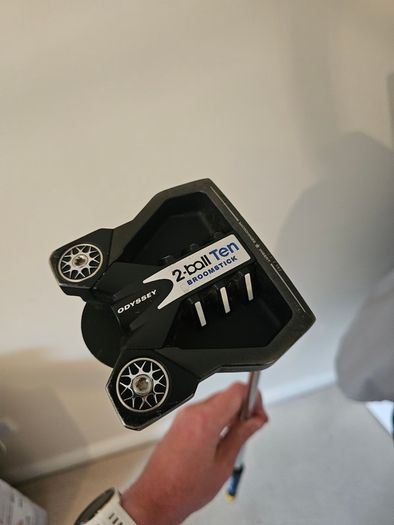 Odyssey broomstick putter.