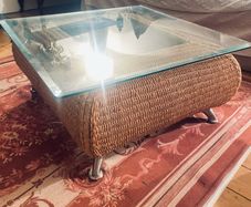Coffee table with glass top and two matching occasional tables
