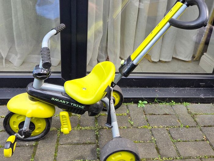 Children's tricycle and little car