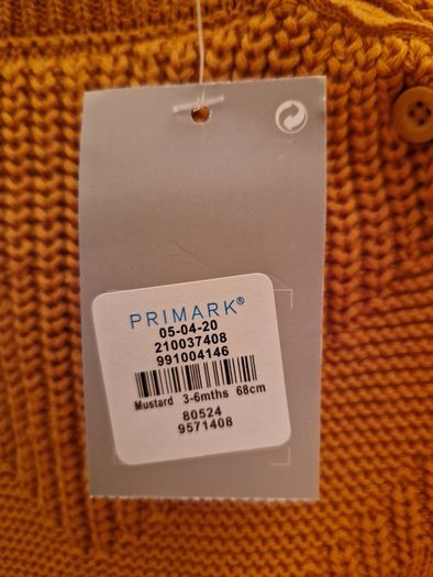 A selection of brand new baby clothes and items