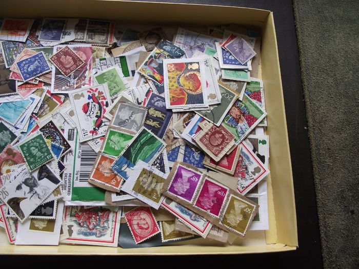 A box with collection of stamps from Great Britain