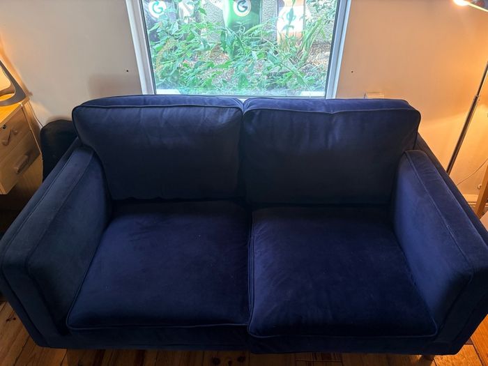 Two seater couch in navy velvet for sale