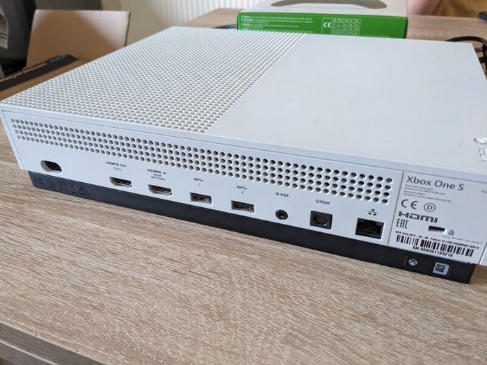 Xbox One S 1TB with controller and cables.