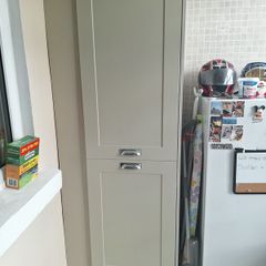 Sage green presses utility room