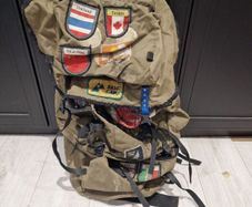 Vintage World Traveler Canvas Backpack  Patch Covered Adventure Rucksack