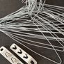 Bundle of white wire clothes hangers Image 2