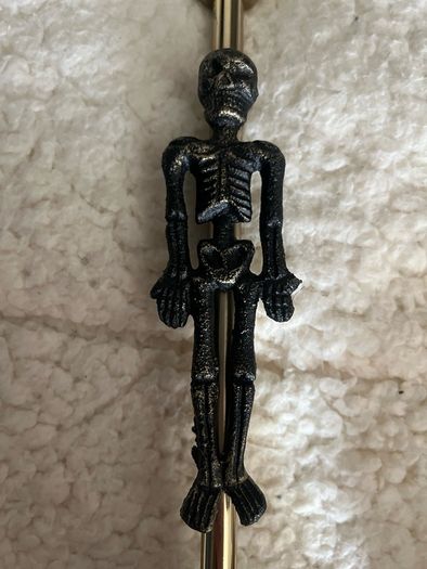 candlestick with a skeleton