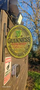Guinness 2 sided cast iron sign
