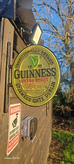 Guinness 2 sided cast iron sign